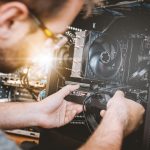 Man installing components into computer