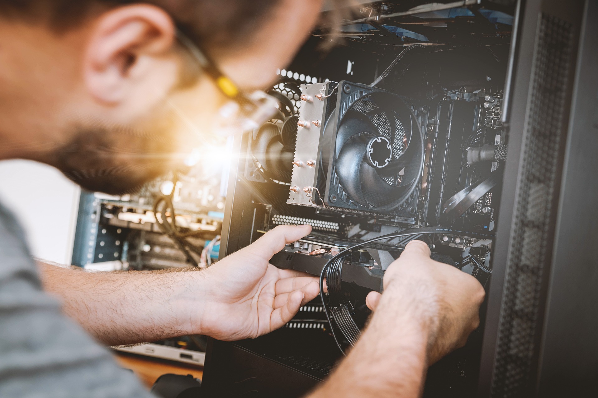 Man installing components into computer