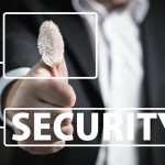 man holding up his thumb that has his fingerprint highlighted in white, with a white square frame linking to the word security in in all caps